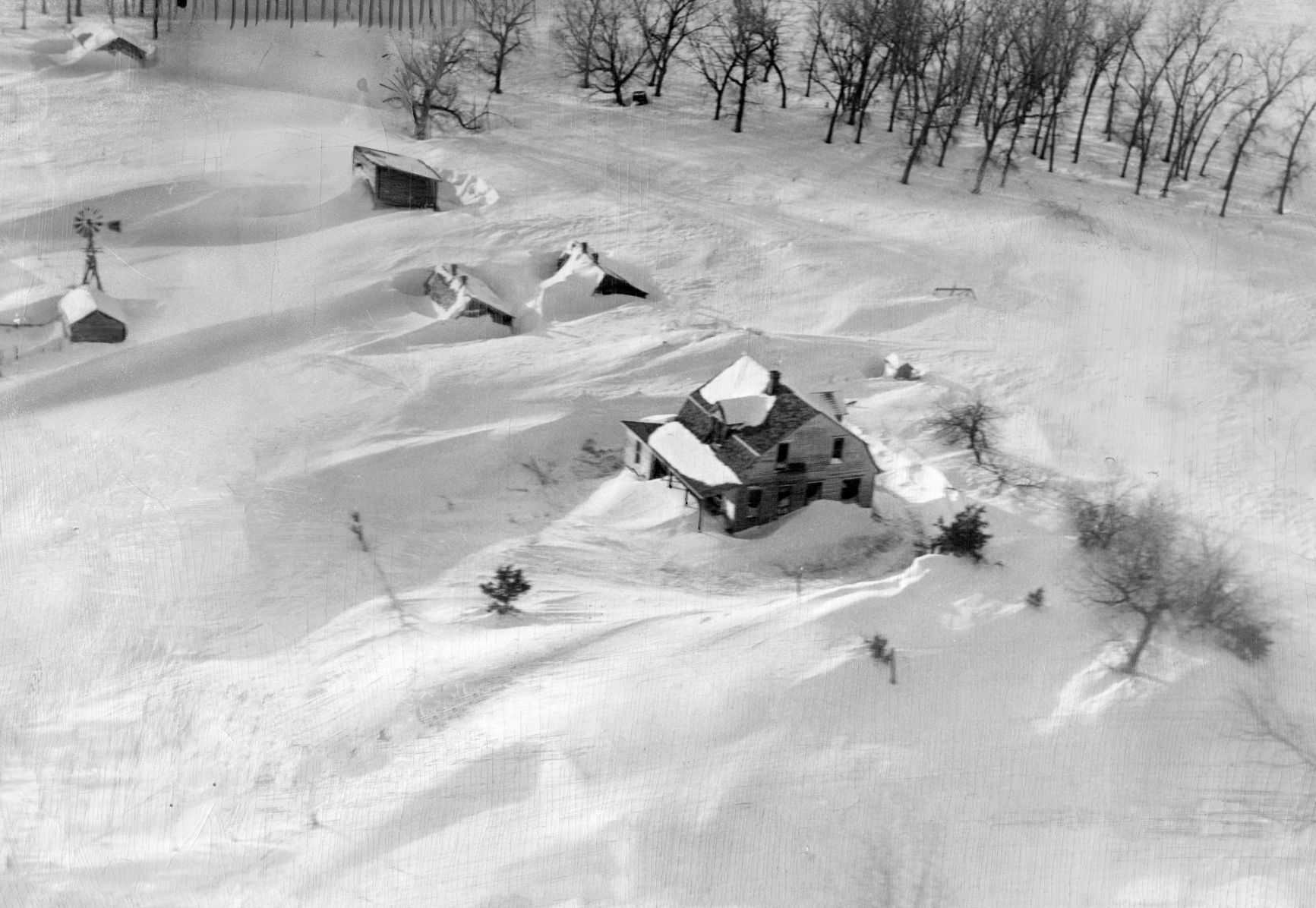 How the Martin Landis ranch 45 miles south of Burwell looked when John McWilliams of the Nebraska Flying Service flew over in a relief mission. Published Feb. 12, 1949.
